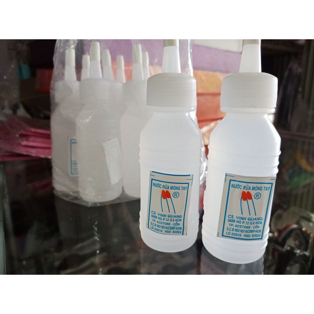 Tẩy mực in trên giấy bằng tăm bông và acetone