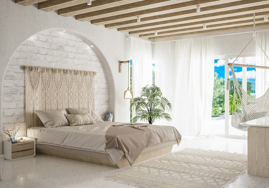 Phòng ngủ kết hợp phong cách Địa Trung Hải và Boho với tường trắng, thảm tua rua và cây xanh trang trí